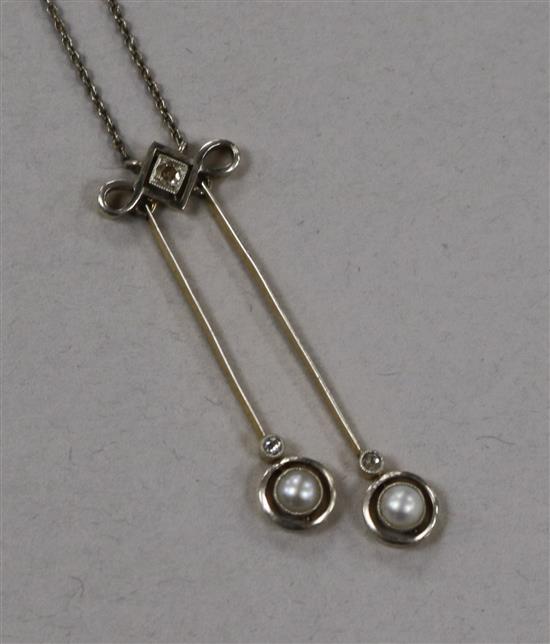 An early 20th century, yellow metal, diamond and split pearl set double drop pendant necklace, pendant 39mm.